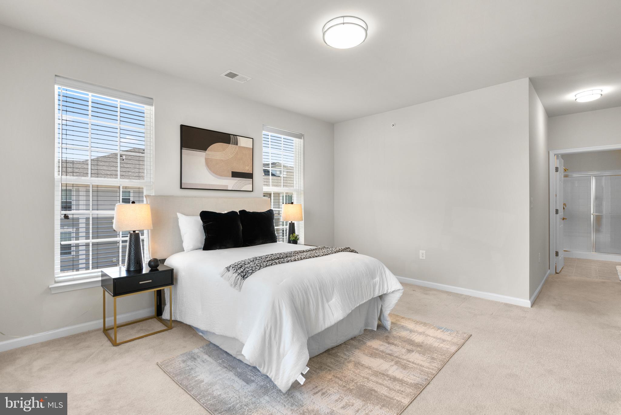 3835 Doc Berlin Drive, Unit 44 Silver Spring, MD 20906 - Photo 18 of 28 a bedroom with a bed and wooden floor