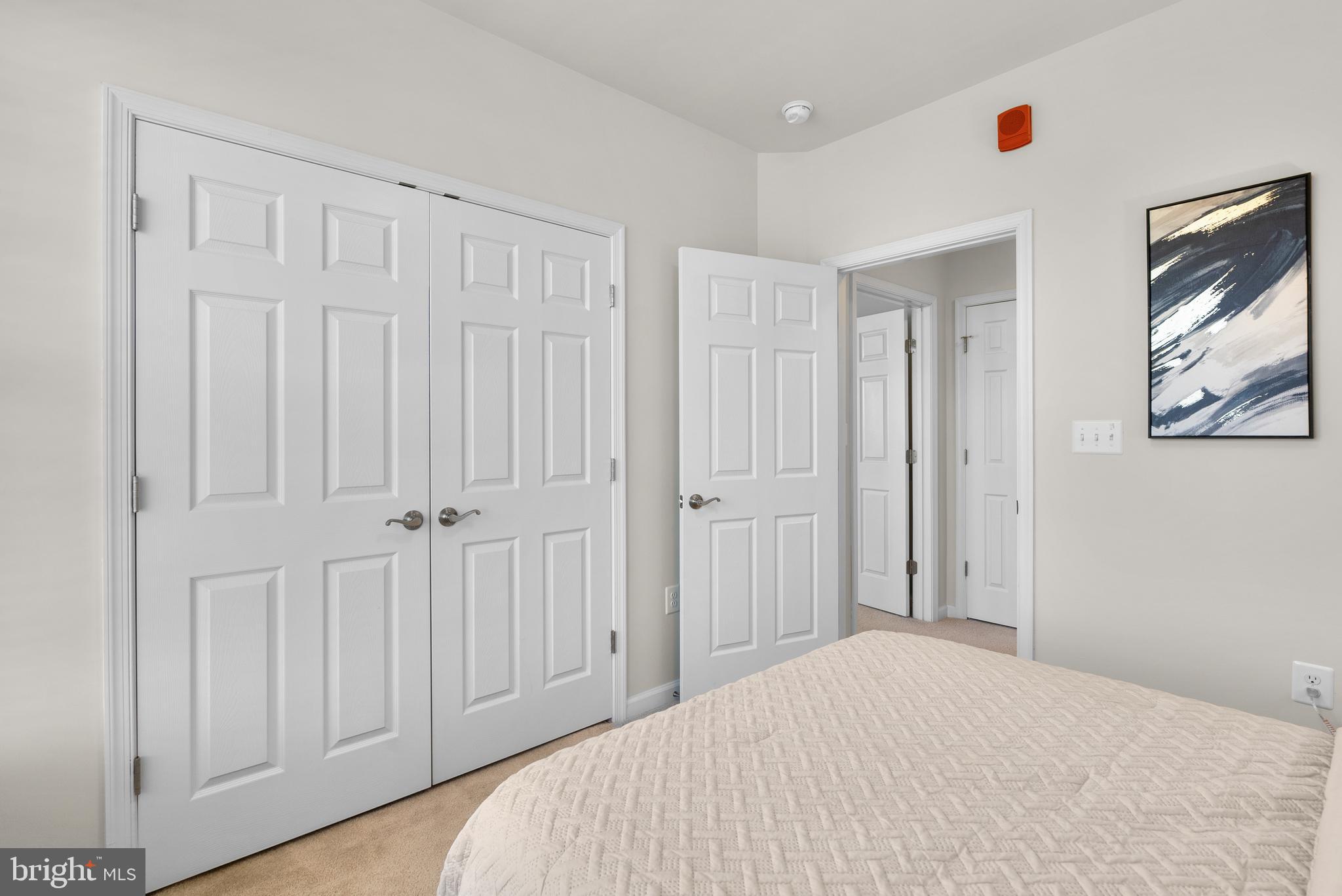 3835 Doc Berlin Drive, Unit 44 Silver Spring, MD 20906 - Photo 23 of 28 a bedroom with a bed and a window