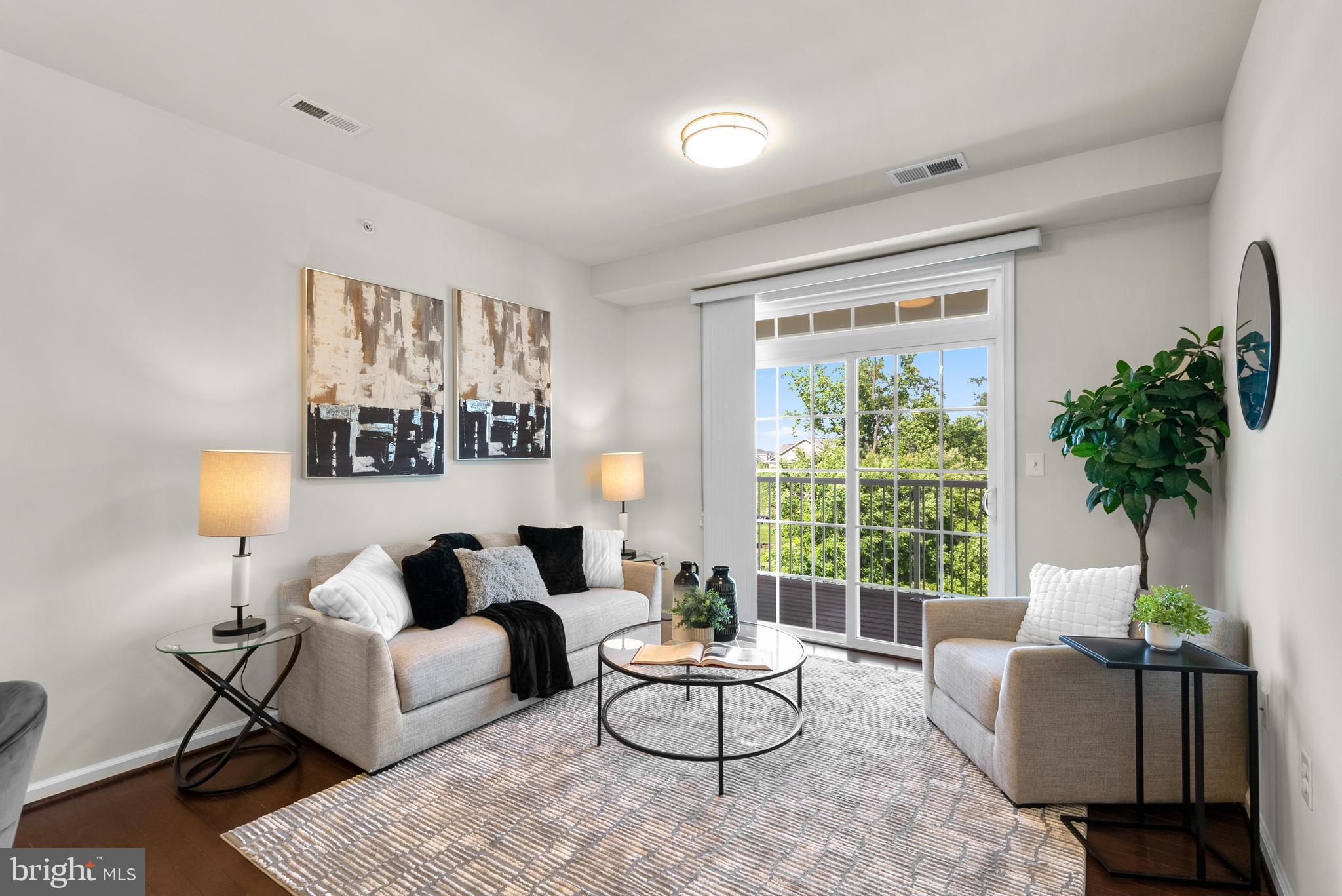 3835 Doc Berlin Drive, Unit 44 Silver Spring, MD 20906 - Photo 5 of 28 a living room with furniture and a large window