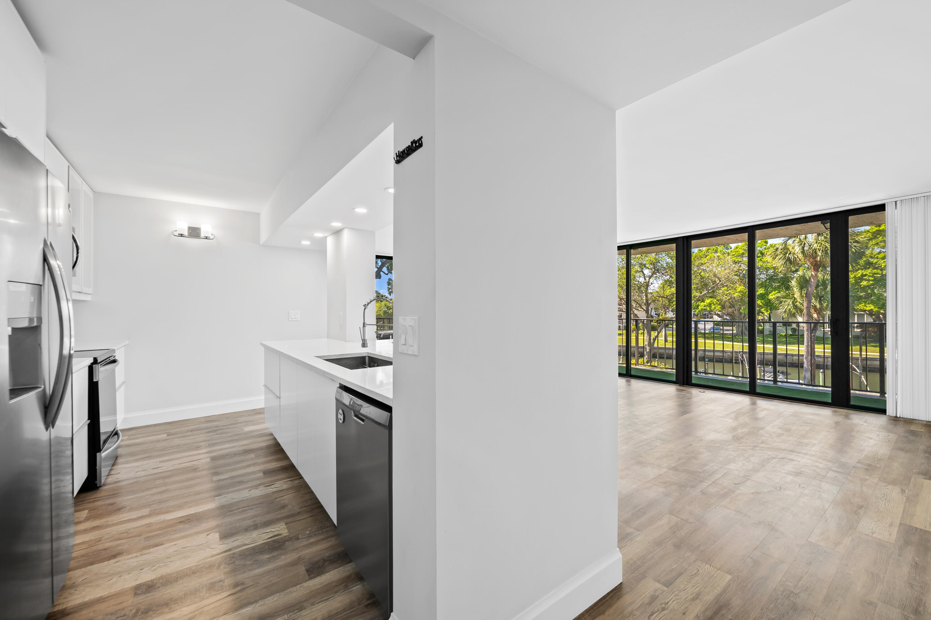 799 Jeffery Street, Unit 202 Boca Raton, FL 33487 - Photo 12 of 39 a view of a kitchen with a sink and cabinets