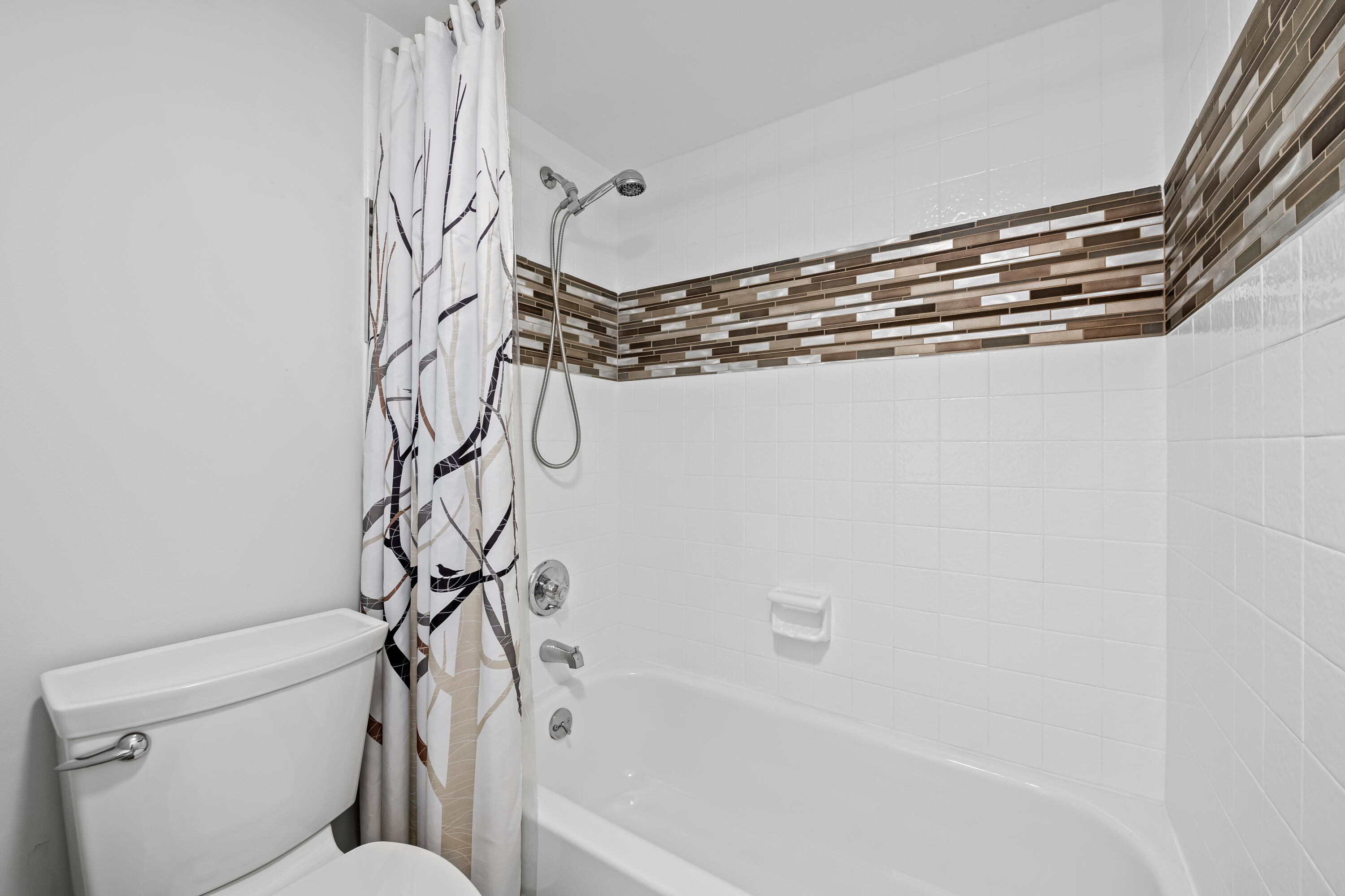 799 Jeffery Street, Unit 202 Boca Raton, FL 33487 - Photo 18 of 39 a bathroom with a bathtub and a shower