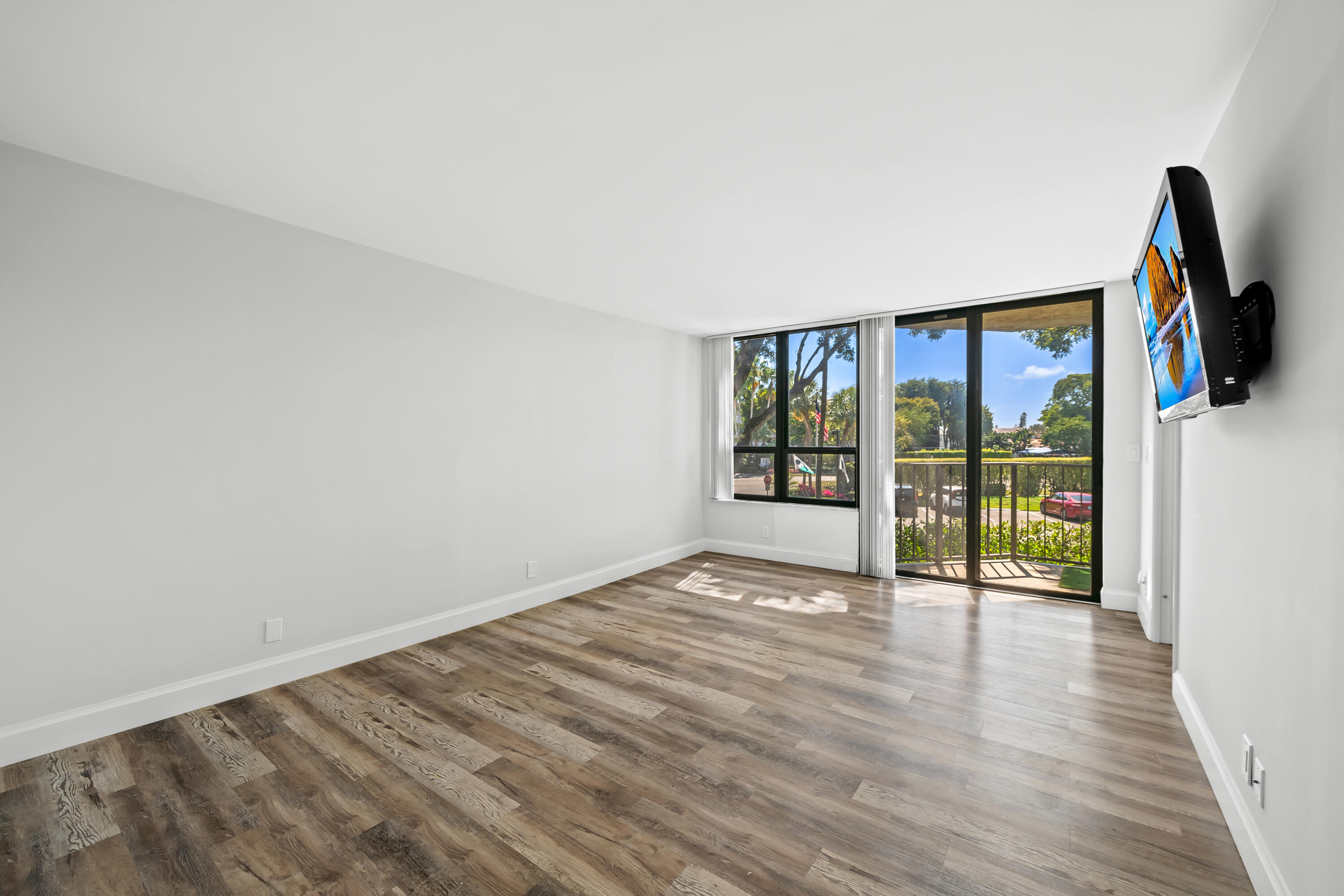 799 Jeffery Street, Unit 202 Boca Raton, FL 33487 - Photo 20 of 39 wooden floor in an empty room with a window