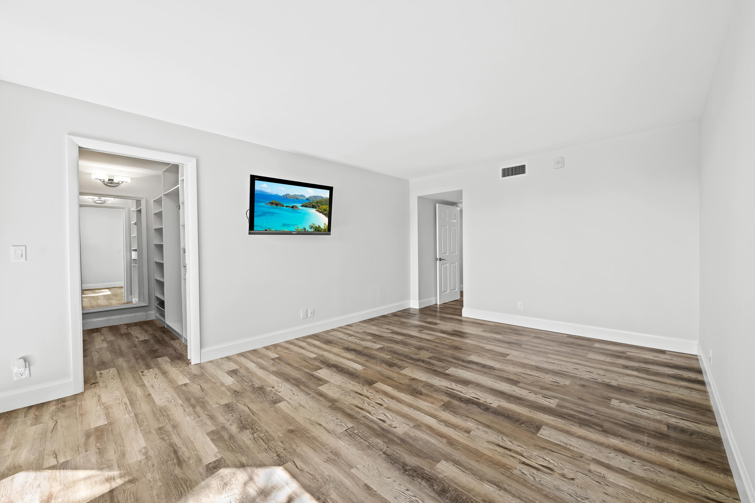 799 Jeffery Street, Unit 202 Boca Raton, FL 33487 - Photo 23 of 39 a view of a livingroom with wooden floor and closet