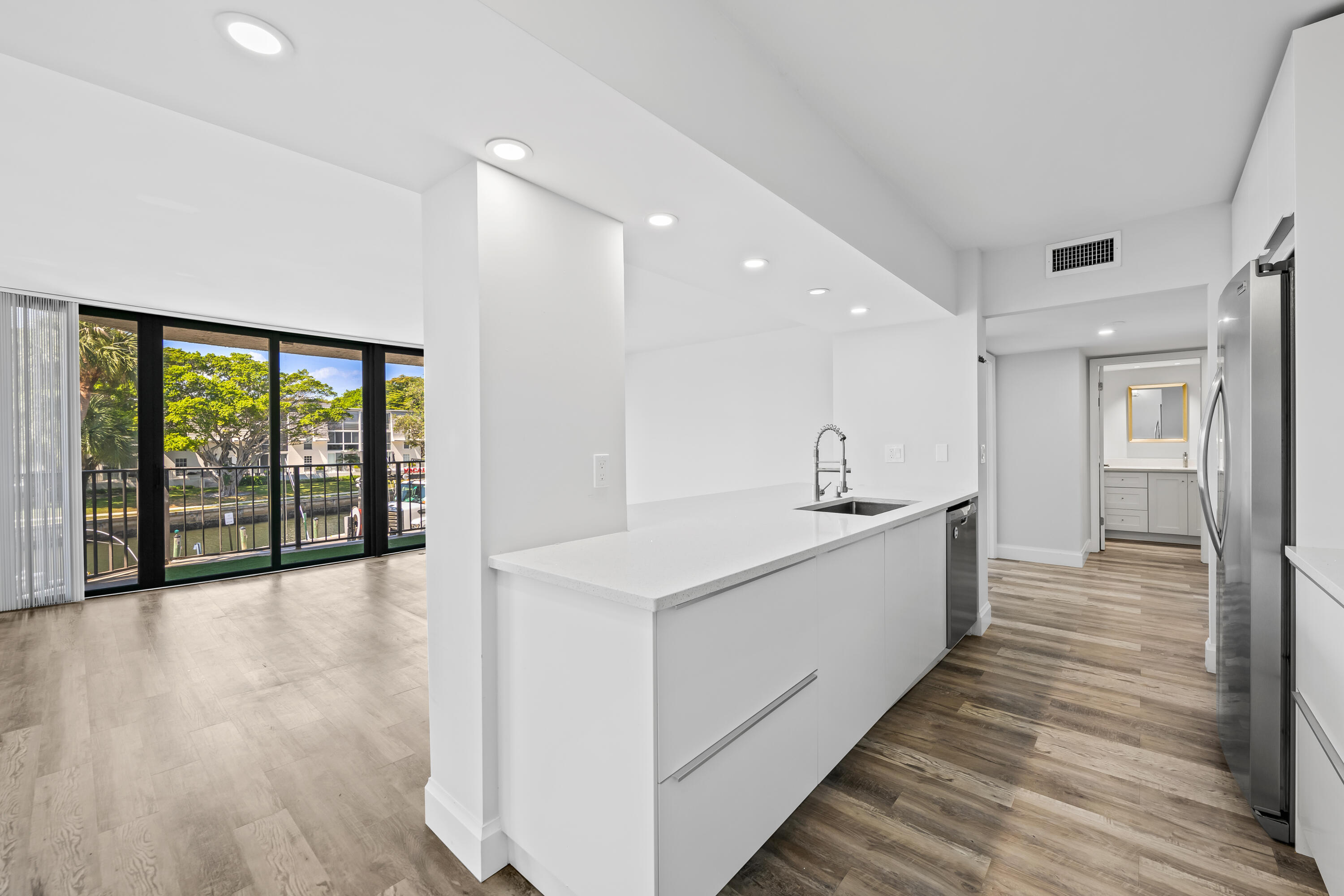 799 Jeffery Street, Unit 202 Boca Raton, FL 33487 - Photo 9 of 39 a large white kitchen with a large window