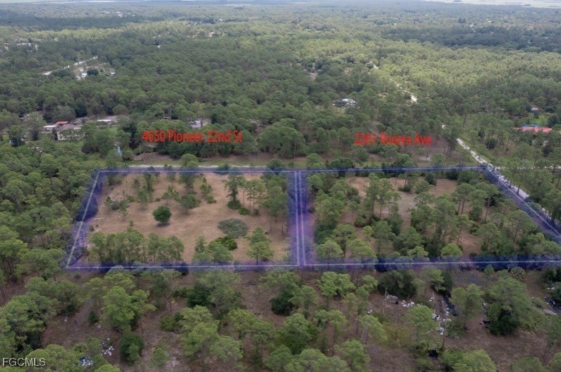 an aerial view of residential house and outdoor space