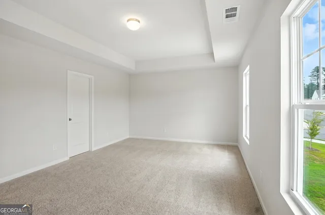 an empty room with windows