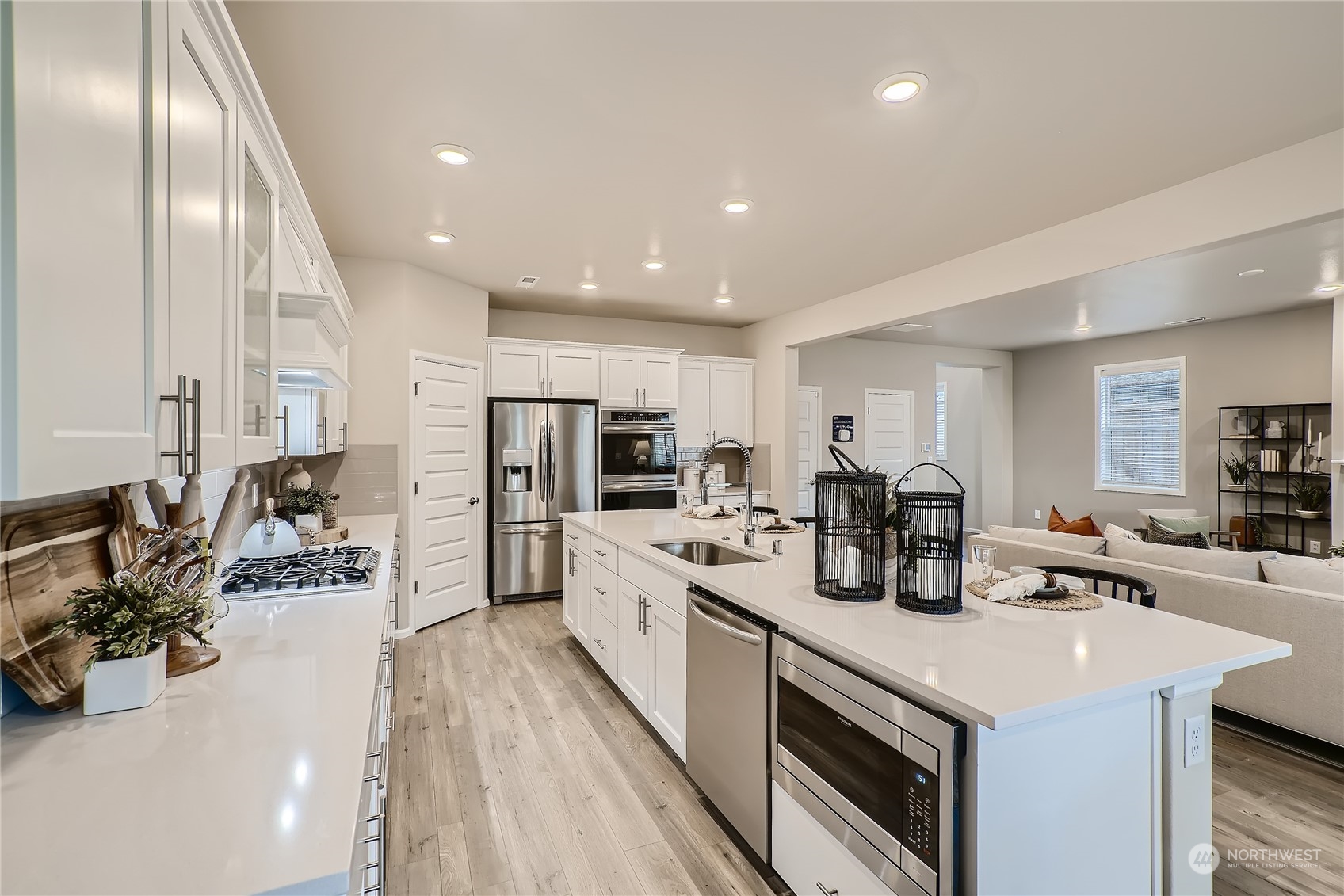 21017 42nd Avenue Southeast, Unit 114 Bothell, WA 98021 - Photo 4 of 22 a kitchen with stainless steel appliances a sink a stove and a refrigerator