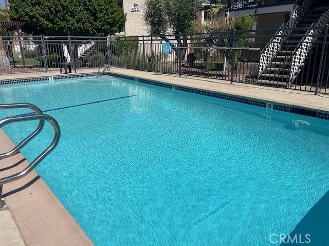 45313 Sunset Lane, Unit B6 #3 Palm Desert, CA 92260 - Photo 1 of 19 a view of a balcony with floor to ceiling windows