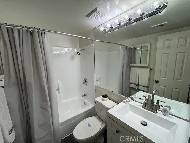 45313 Sunset Lane, Unit B6 #3 Palm Desert, CA 92260 - Photo 12 of 19 a bathroom with a sink toilet mirror and shower
