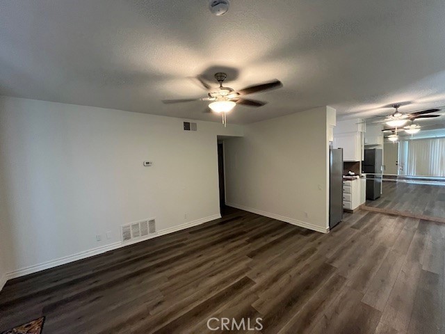 45313 Sunset Lane, Unit B6 #3 Palm Desert, CA 92260 - Photo 3 of 19 a view of an empty room with wooden floor