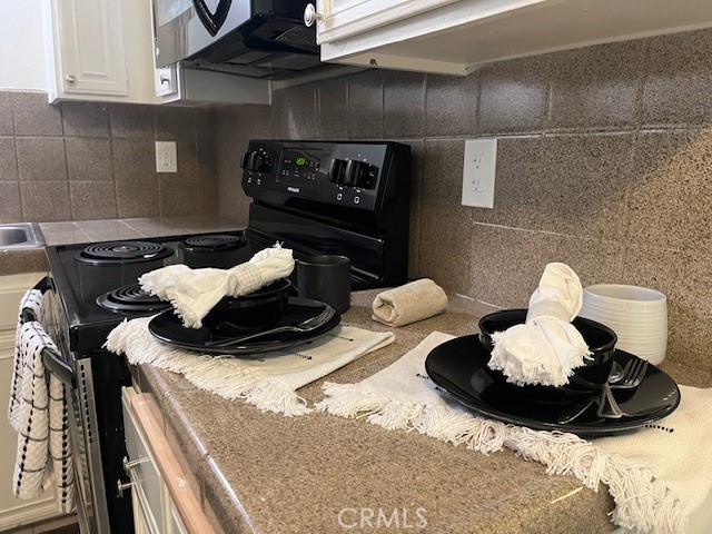 45313 Sunset Lane, Unit B6 #3 Palm Desert, CA 92260 - Photo 8 of 19 a kitchen with a sink and a stove