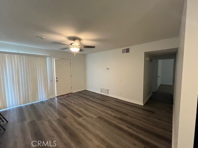 45313 Sunset Lane, Unit B6 #3 Palm Desert, CA 92260 - Photo 9 of 19 wooden floor in an empty room with a mirror