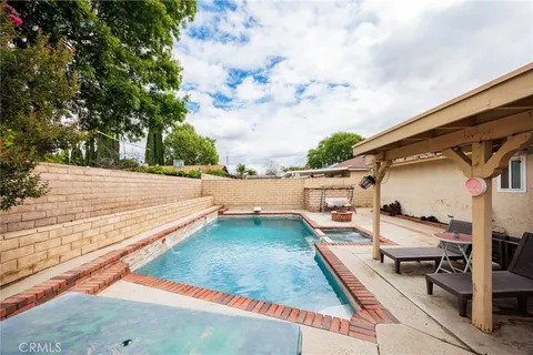 a view of a backyard with sitting area
