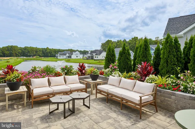 a front view of house with yard and outdoor seating
