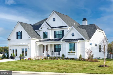 an aerial view of a houses with a yard