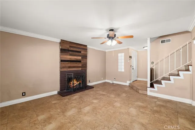 a view of an empty room with a fireplace