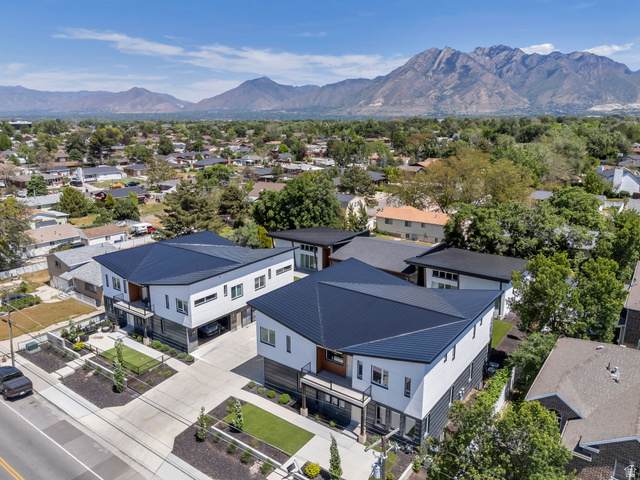 7045 South 300 East Midvale, UT 84047 - Photo 5 of 49 Modern architectural style featuring white siding and black metal roofing