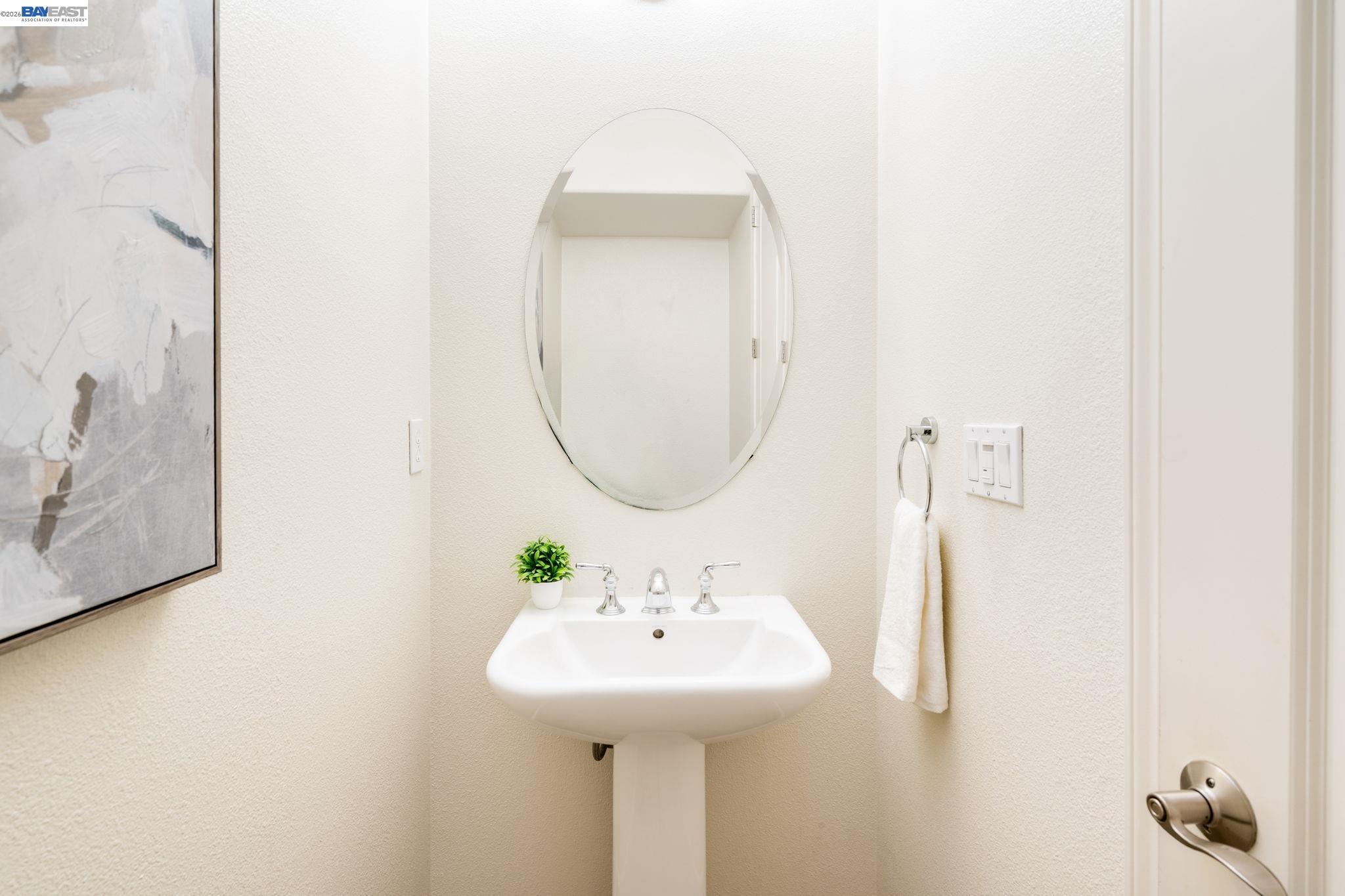 4653 Rimini Court Dublin, CA 94568 - Photo 18 of 44 a bathroom with a sink and a mirror