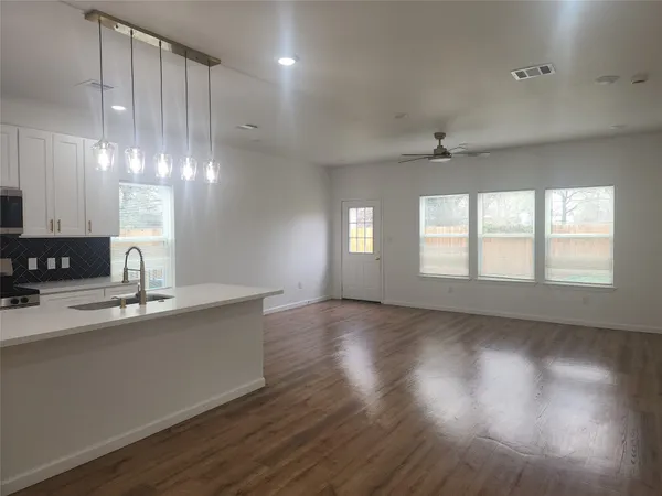 a view of a kitchen with marble kitchen and sink