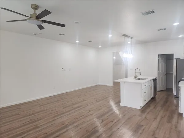 a view of cabinets and wooden floor