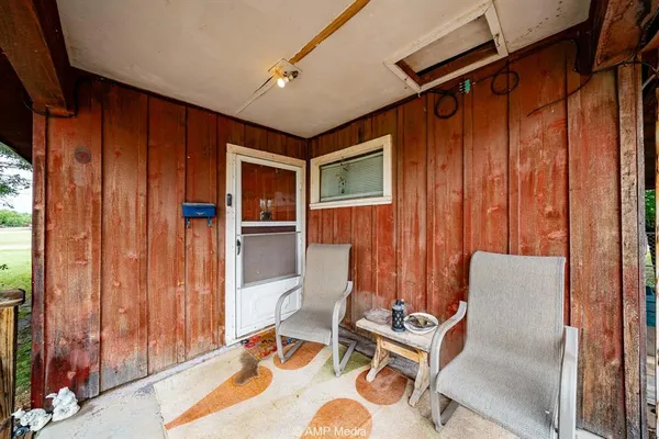 a room with furniture and wooden floor