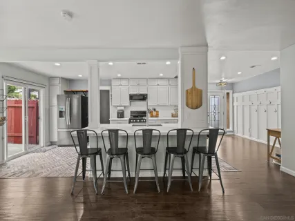 a view of a dining room with furniture and wooden floor
