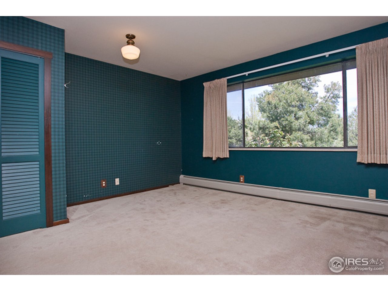 6686 Jay Road Boulder, CO 80301 - Photo 12 of 18 a view of an empty room with a window
