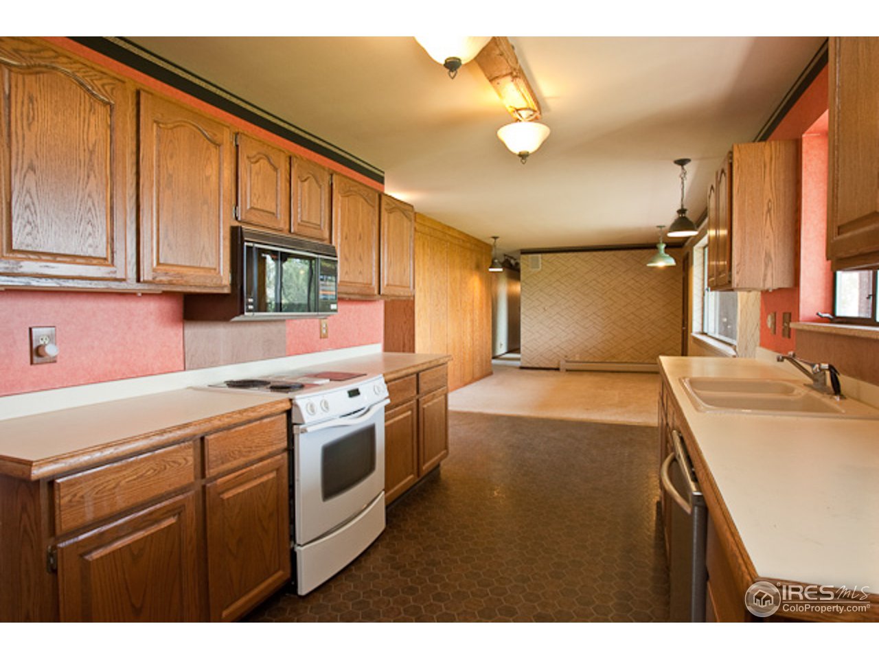 6686 Jay Road Boulder, CO 80301 - Photo 7 of 18 a kitchen that has a sink and a stove in it