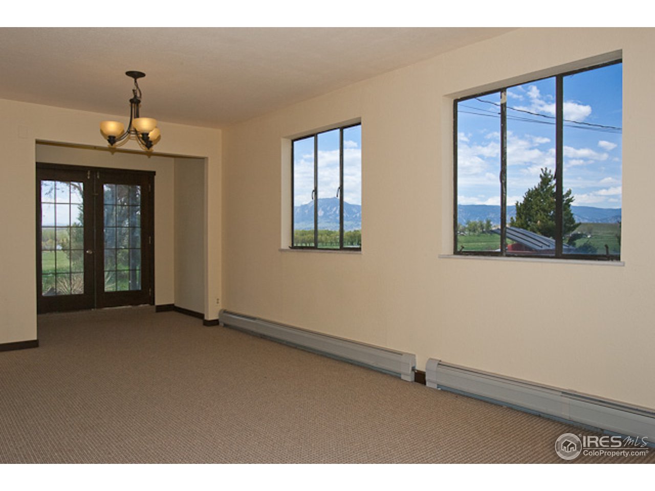 6686 Jay Road Boulder, CO 80301 - Photo 9 of 18 a view of an empty room with a window