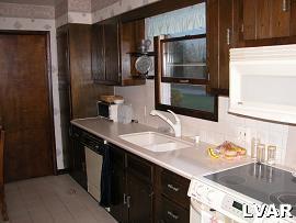 939 Valley View Road Coopersburg, PA 18036 - Photo 8 of 15 Corian countertops, undermount sink, cooktop stove, & microwave