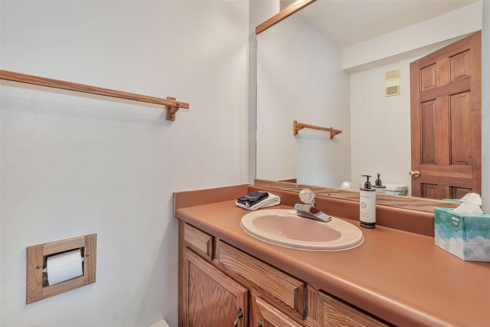 1720 Ranch Road, Unit 309 Steamboat Springs, CO 80487 - Photo 13 of 43 a bathroom with a sink and a mirror
