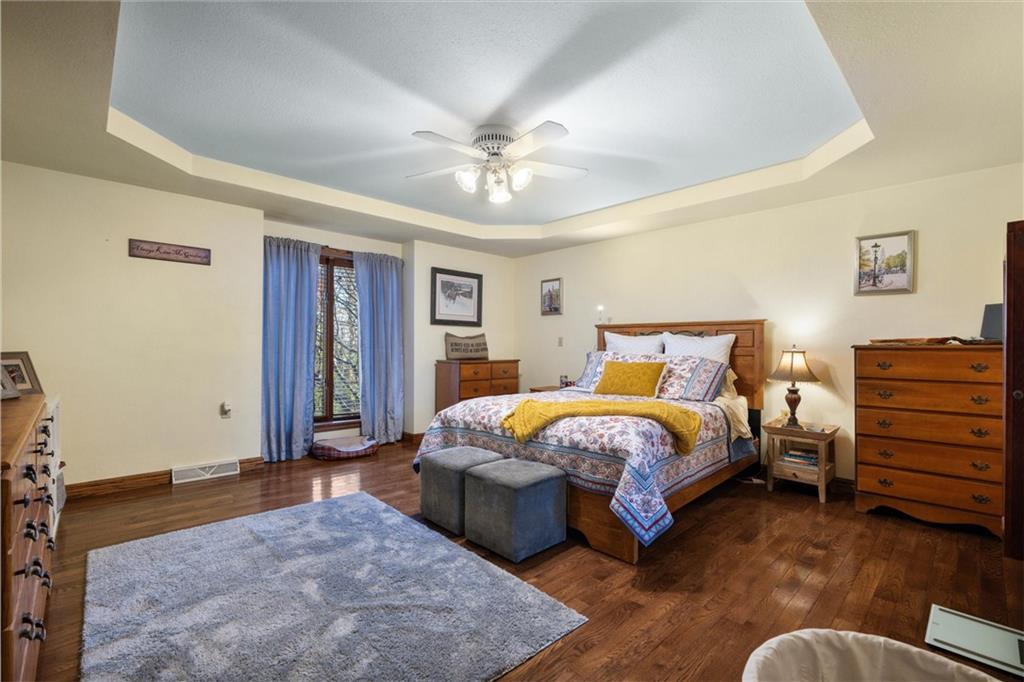 338 Quarry Road Washington, PA 15301 - Photo 12 of 50 a spacious bedroom with a bed and a chandelier