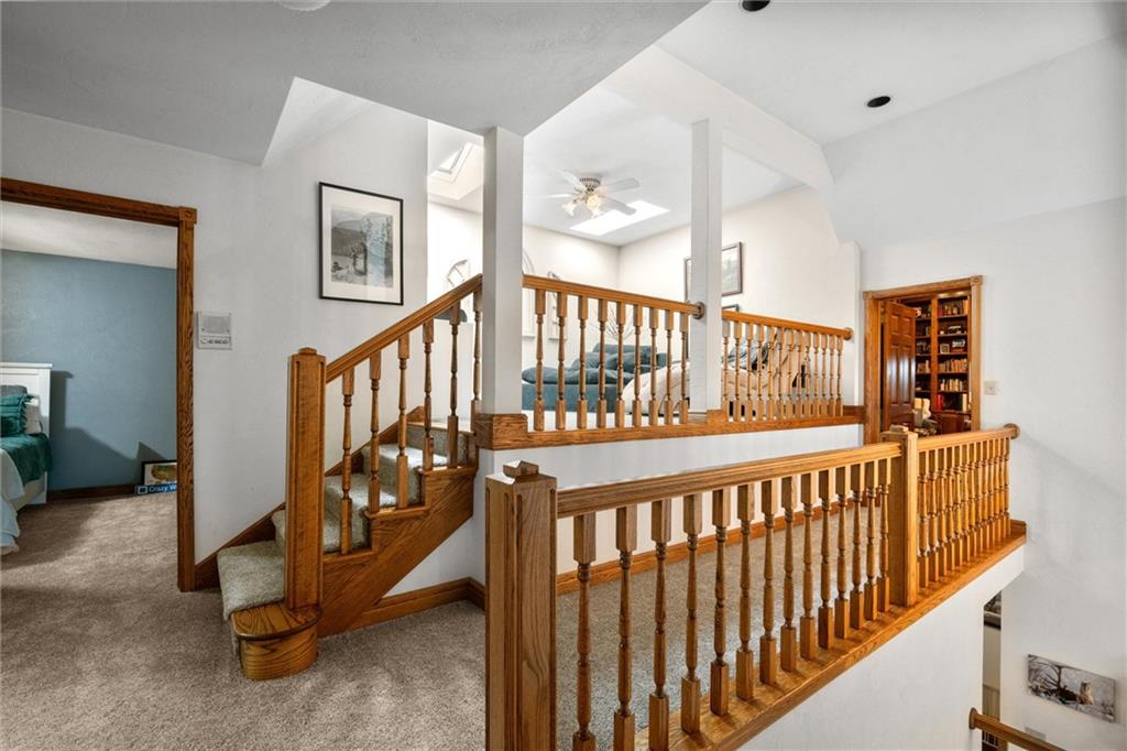 338 Quarry Road Washington, PA 15301 - Photo 15 of 50 a view of staircase with lots of frames on wall