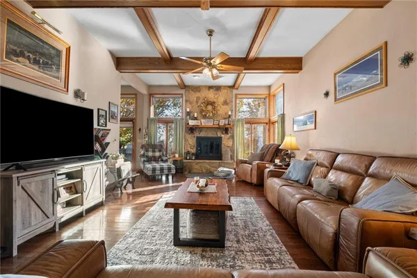 a living room with furniture fireplace and flat screen tv
