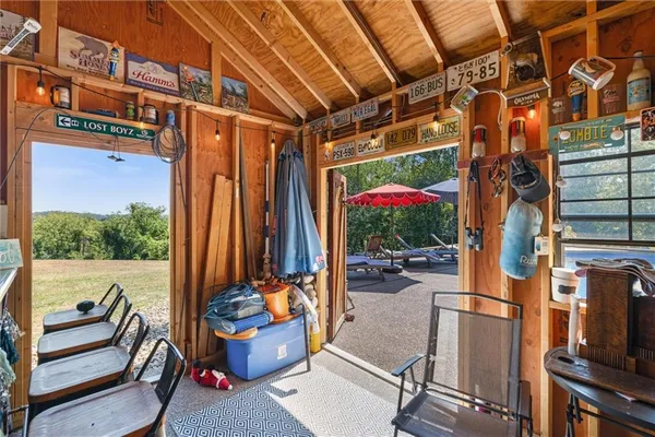 a view of living room with a table and chairs