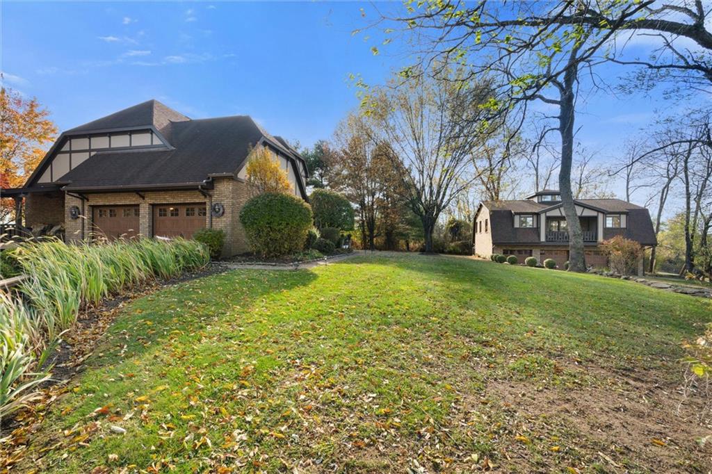 338 Quarry Road Washington, PA 15301 - Photo 36 of 50 a front view of a house with garden