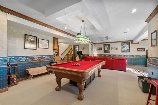 a room with table tennis pool table and windows