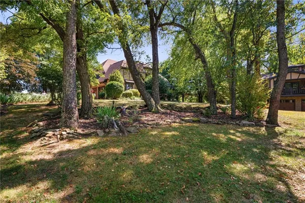 a backyard of a house with lots of green space