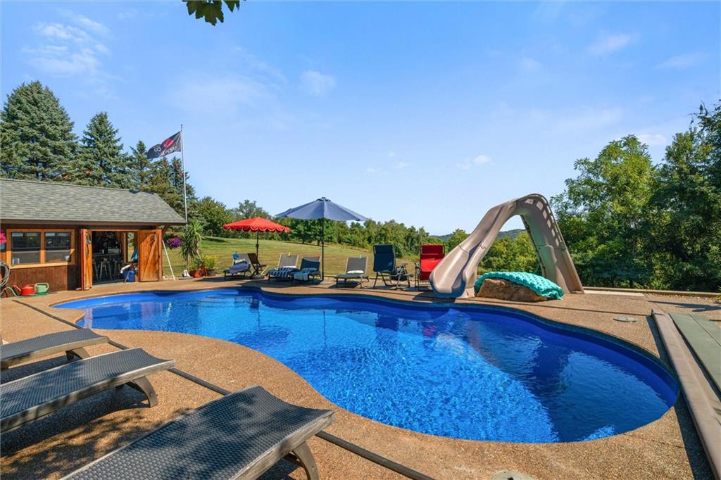 338 Quarry Road Washington, PA 15301 - Photo 8 of 50 a view of a swimming pool with lounge chairs