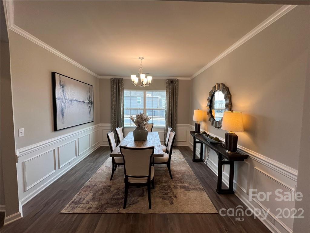 4027 Havenport Circle, Unit 121 Tega Cay, SC 29708 - Photo 5 of 24 a view of a dining room with furniture window and wooden floor