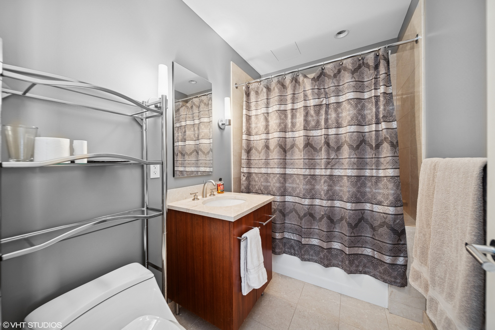 401 North Wabash Avenue, Unit 56D Chicago, IL 60611 - Photo 11 of 24 a bathroom with a sink a toilet a shower and a mirror