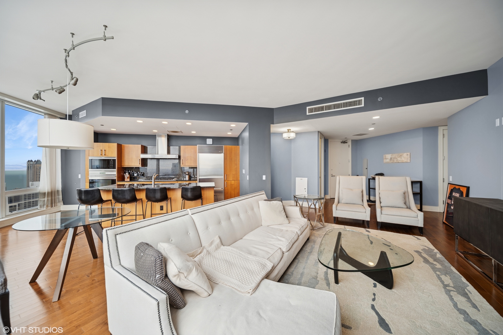 401 North Wabash Avenue, Unit 56D Chicago, IL 60611 - Photo 5 of 24 a living room with furniture and a flat screen tv