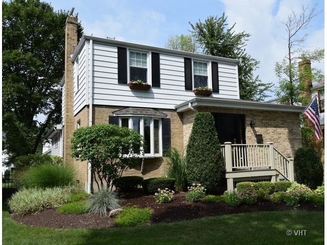 924 Spring Road Elmhurst, IL 60126 - Photo 1 of 18 a front view of a house with a yard