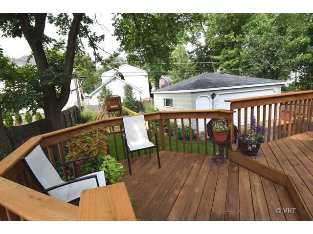 924 Spring Road Elmhurst, IL 60126 - Photo 17 of 18 a view of deck with furniture and trees around