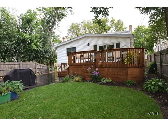 924 Spring Road Elmhurst, IL 60126 - Photo 18 of 18 a view of a house with a yard and deck