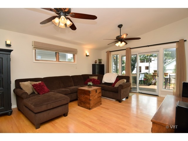 924 Spring Road Elmhurst, IL 60126 - Photo 9 of 18 a living room with furniture or outdoor view and a chandelier