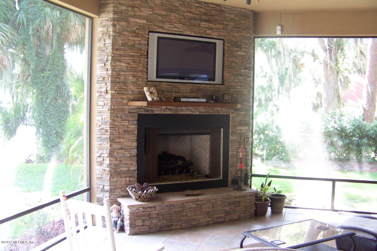 139 Parker Road Crescent City, FL 32112 - Photo 37 of 59 Fireplace & TV in Screened Room