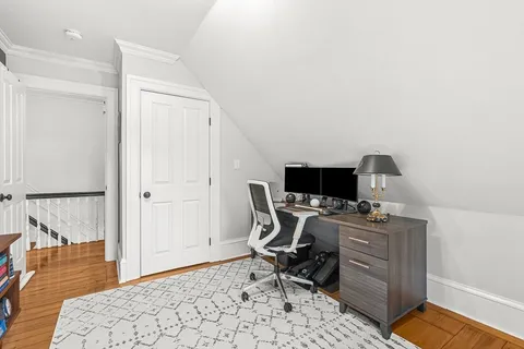a workspace with furniture and wooden floor