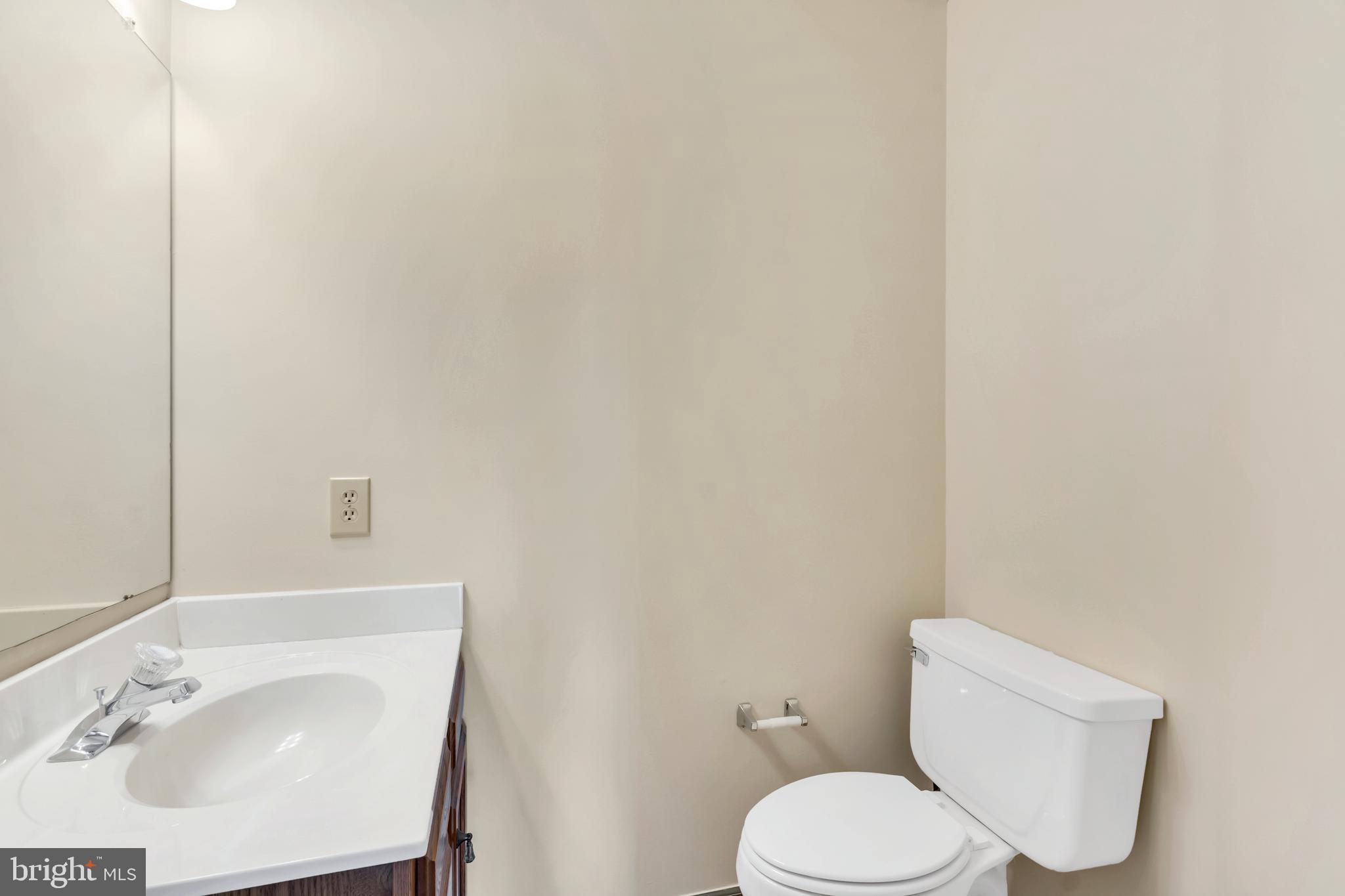 2908 Garwood Road Sicklerville, NJ 08081 - Photo 20 of 25 a white toilet sitting next to a bathroom sink