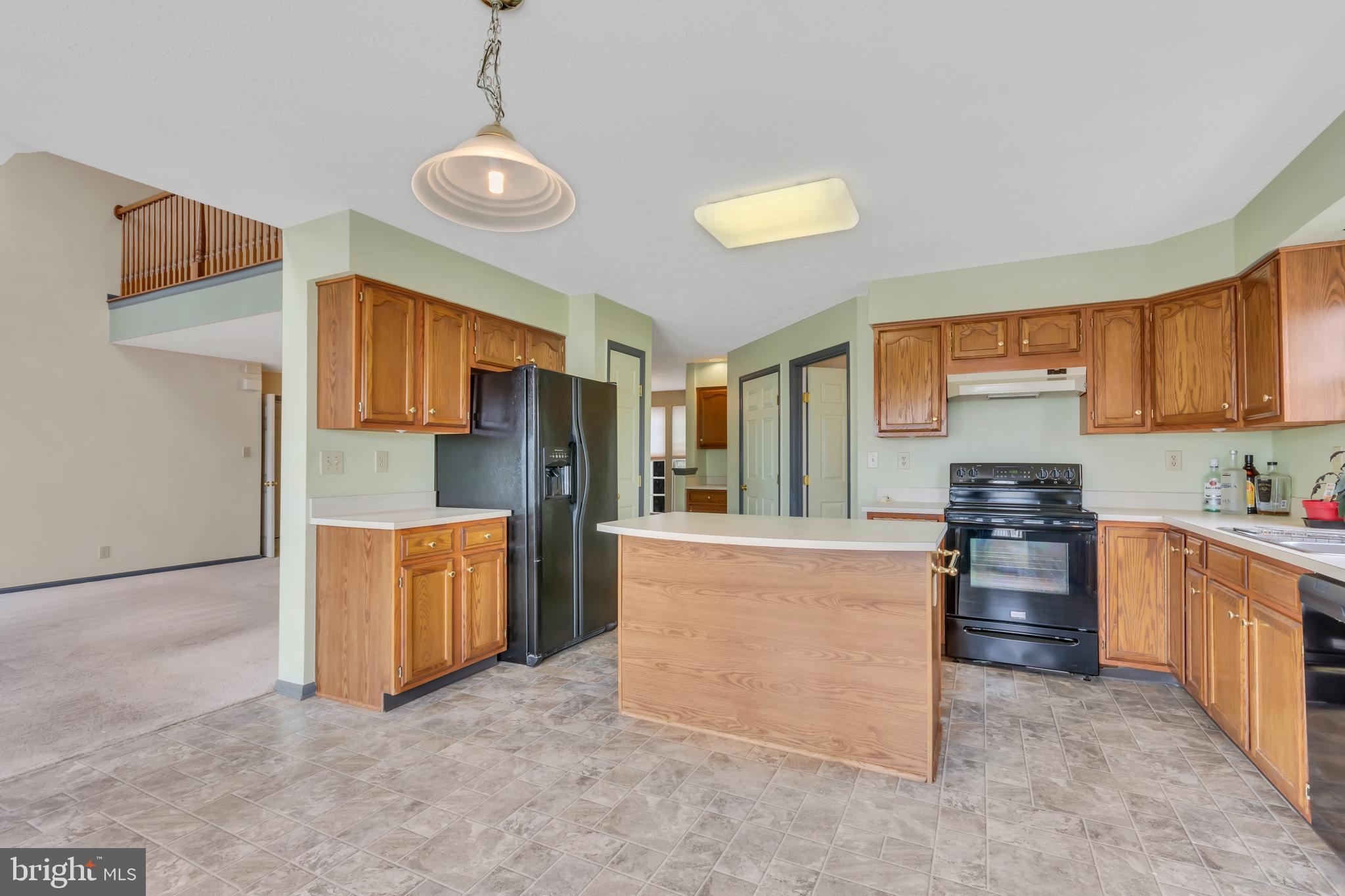 2908 Garwood Road Sicklerville, NJ 08081 - Photo 8 of 25 a kitchen with stainless steel appliances granite countertop a stove top oven a refrigerator a sink and dishwasher